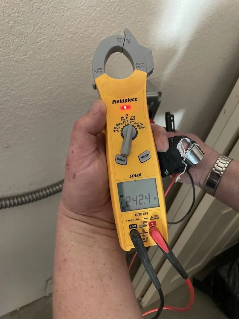 Voltage testing with clamp meter during Ceiling Fan Installation in Kenmore